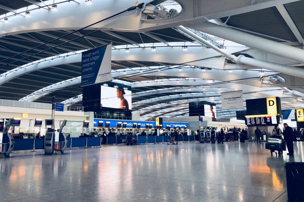 Image of airport with tension fabric display via Unsplash