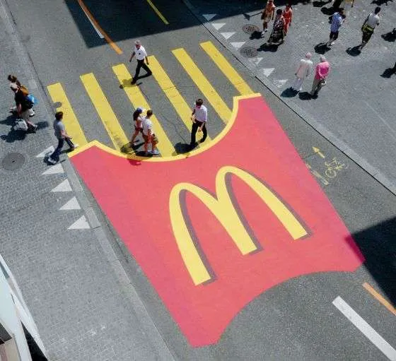 Example of guerilla marketing: image of crosswalk painted to look like Mcdonalds fries