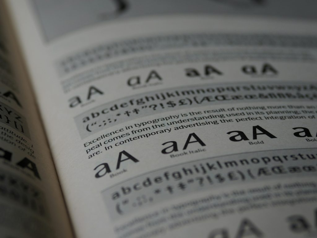 Close-up of a page in a book that talks about typography